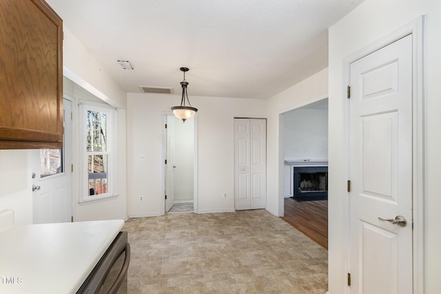 kitchen with hanging light fixtures and dishwashing machine