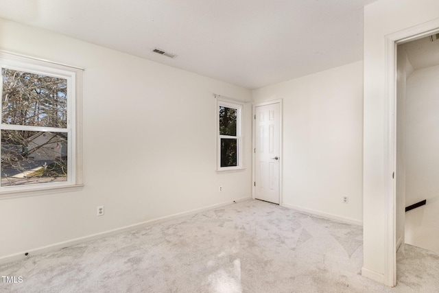 unfurnished bedroom with light carpet