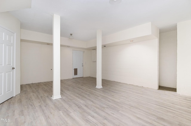 basement featuring light hardwood / wood-style floors