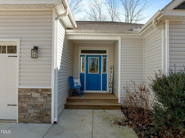 entrance to property featuring a garage