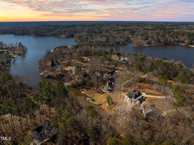 aerial view at dusk with a water view