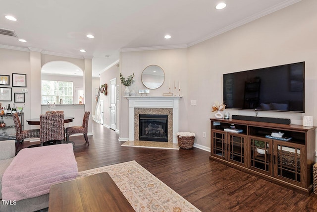 living room featuring dark hardwood / wood-style flooring and ornamental molding