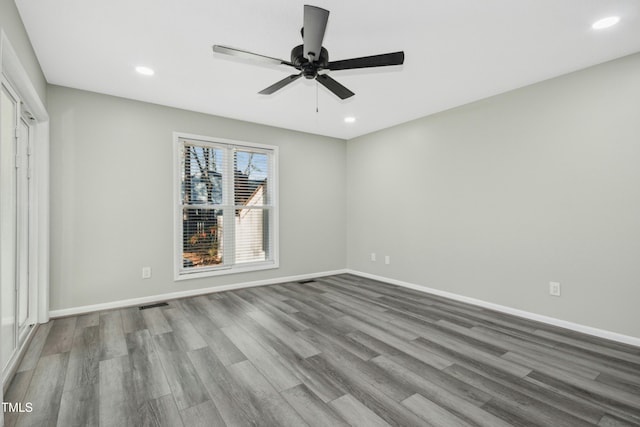 unfurnished bedroom with ceiling fan and wood-type flooring