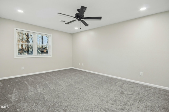 unfurnished room featuring ceiling fan and carpet flooring