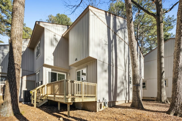 rear view of house featuring a deck and central AC