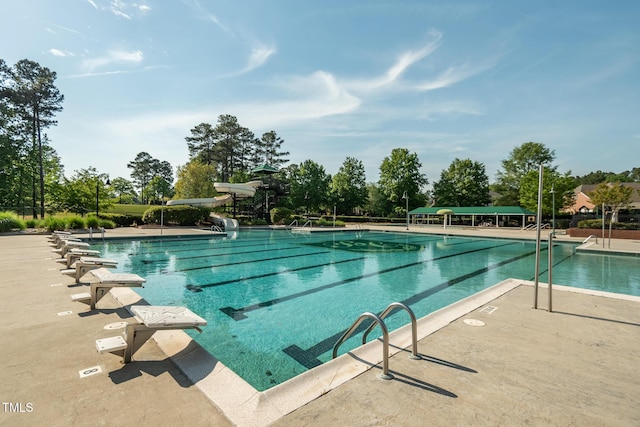 view of pool with a water slide