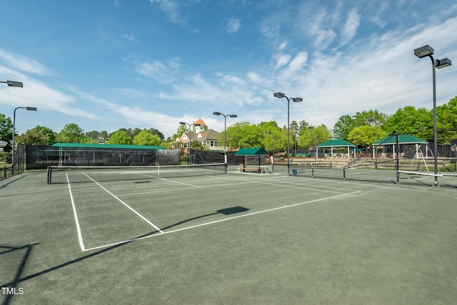 view of tennis court with a gazebo