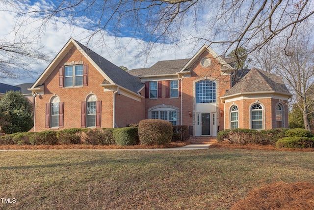 front facade with a front lawn