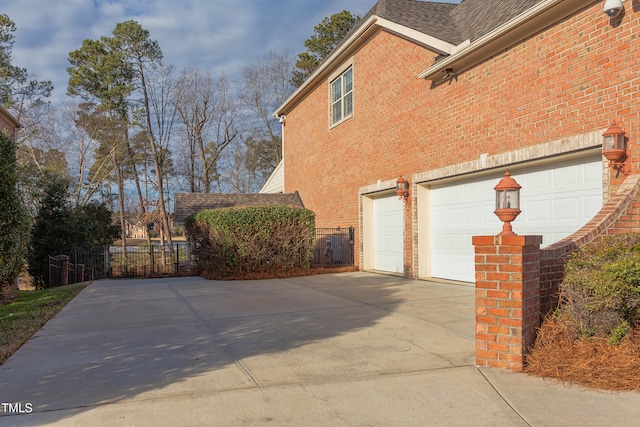 view of side of home with a garage