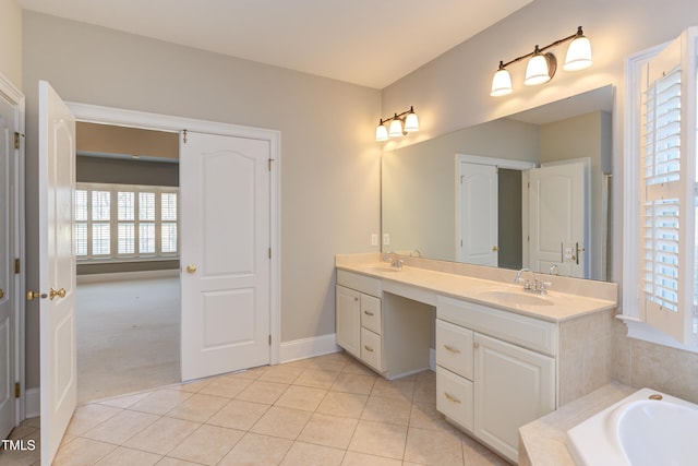 bathroom featuring vanity, tiled tub, and tile patterned floors