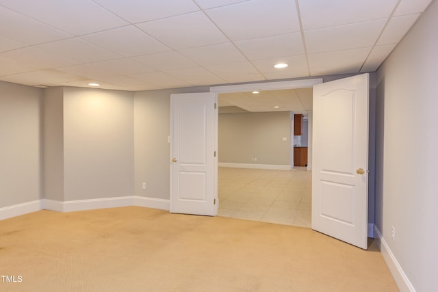 basement featuring light colored carpet