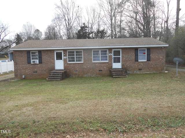 ranch-style house with entry steps, fence, brick siding, and crawl space