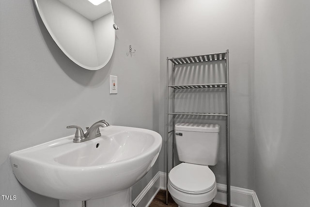 bathroom with sink and toilet