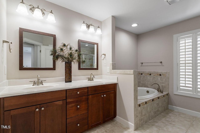 bathroom featuring tile patterned flooring, a garden tub, a sink, and double vanity