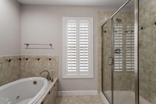 bathroom featuring tile patterned floors and independent shower and bath