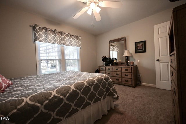 bedroom featuring ceiling fan and carpet