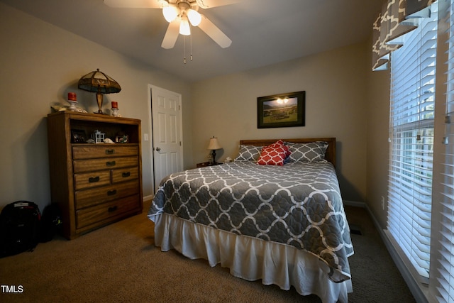 carpeted bedroom featuring ceiling fan