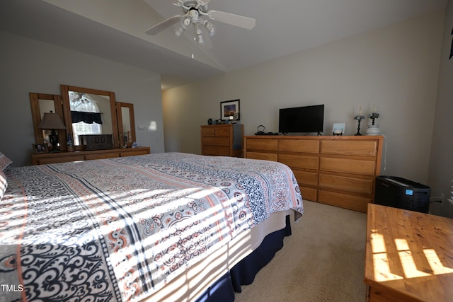 carpeted bedroom featuring vaulted ceiling and ceiling fan