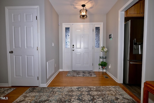 foyer featuring dark hardwood / wood-style floors