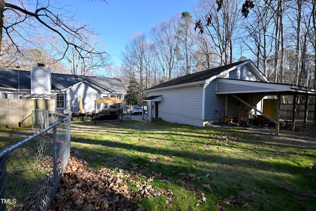 view of side of property with a yard