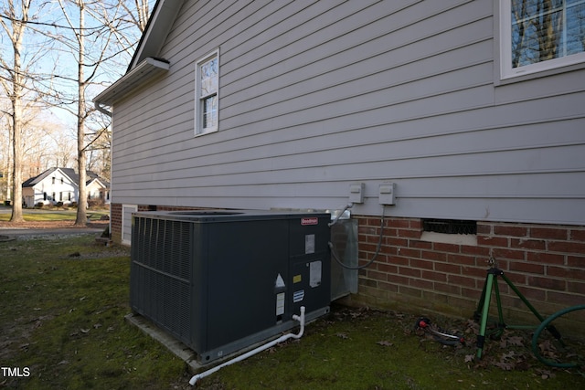 view of side of property with central AC unit