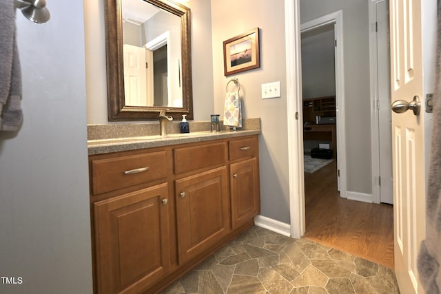 bathroom featuring vanity and baseboards