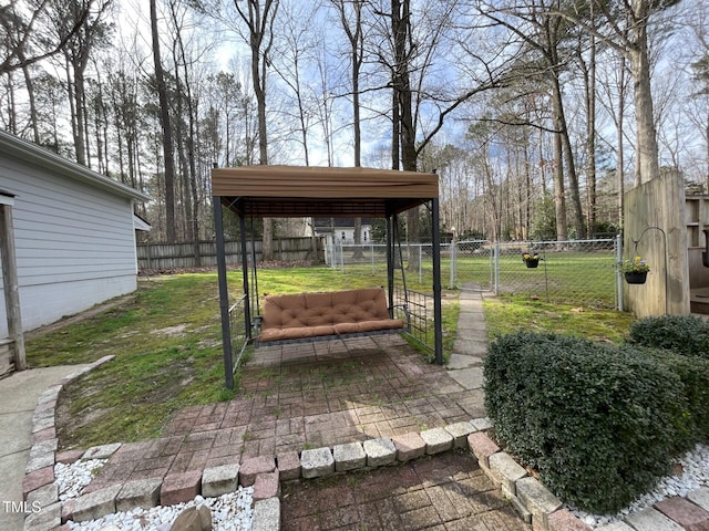 view of yard featuring a fenced backyard and a gate