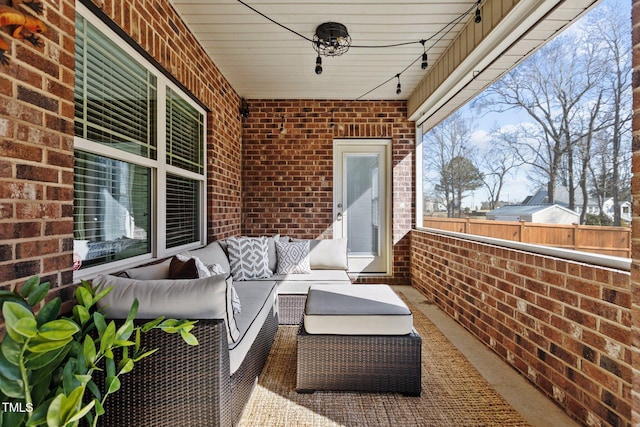 view of patio / terrace with fence and an outdoor hangout area