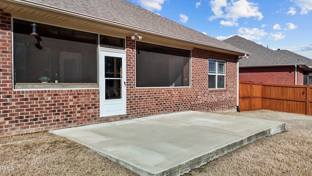 view of patio featuring fence