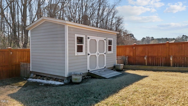 view of shed with a fenced backyard