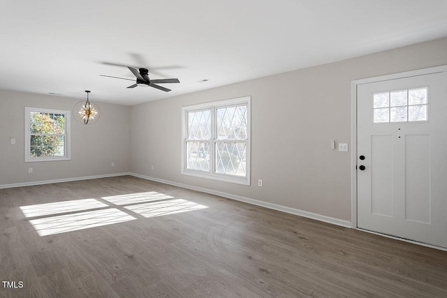 foyer entrance featuring ceiling fan and wood-type flooring