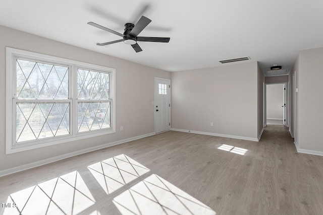 interior space with ceiling fan and light hardwood / wood-style floors