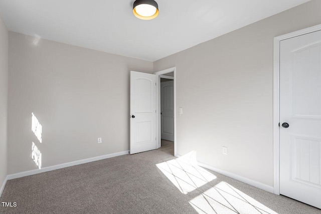 unfurnished bedroom with light carpet