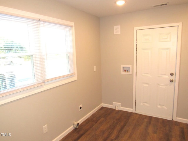 clothes washing area with hookup for a washing machine, dark hardwood / wood-style floors, and hookup for an electric dryer