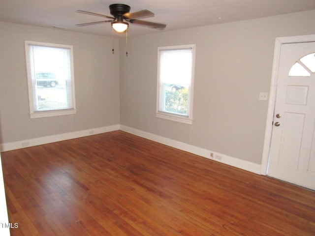 foyer featuring ceiling fan and dark hardwood / wood-style floors