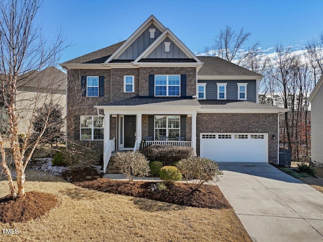 craftsman house featuring covered porch and a garage