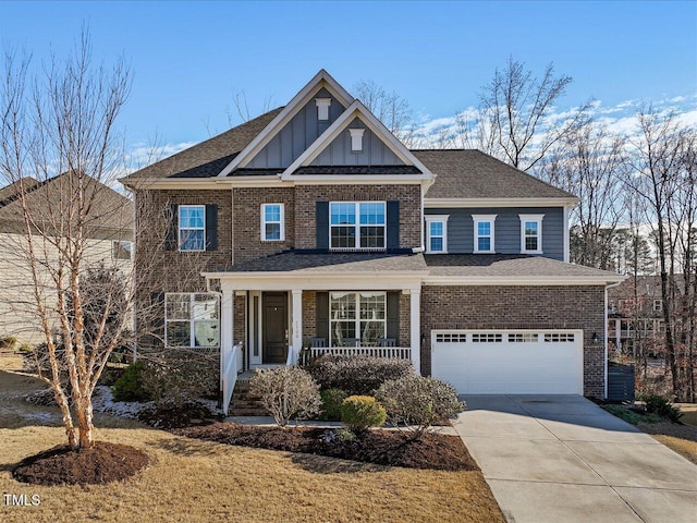 craftsman house with covered porch and a garage