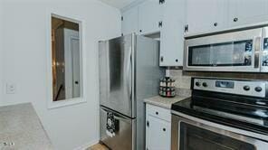 kitchen with white cabinets and stainless steel appliances