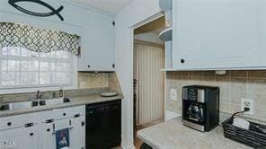 kitchen with sink, white cabinetry, backsplash, and black dishwasher