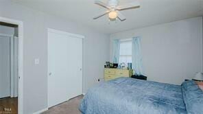 bedroom featuring ceiling fan