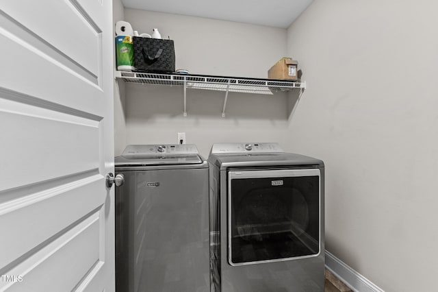 laundry room featuring separate washer and dryer