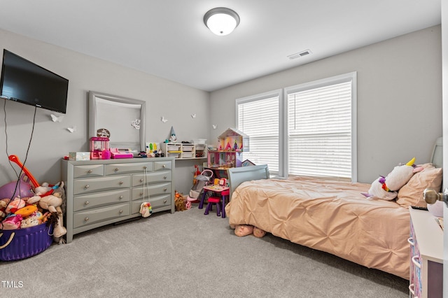 bedroom with light colored carpet