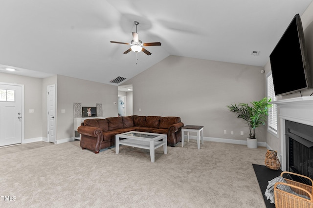 carpeted living room featuring high vaulted ceiling and ceiling fan