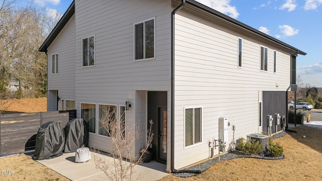 back of property featuring cooling unit