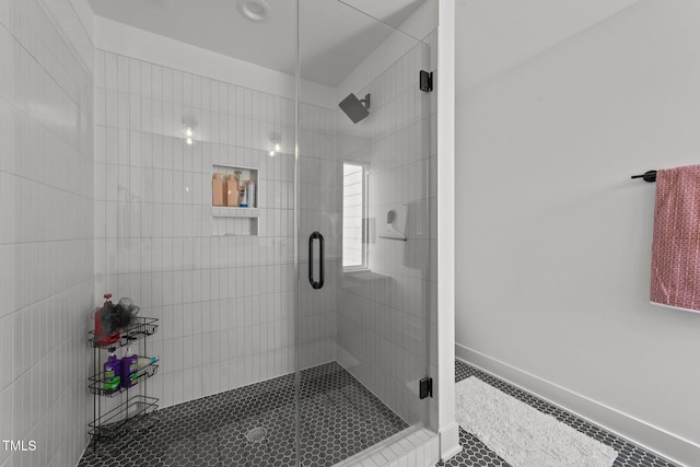 bathroom featuring walk in shower and tile patterned floors