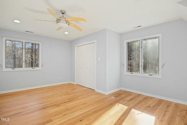 spare room featuring ceiling fan and light hardwood / wood-style flooring