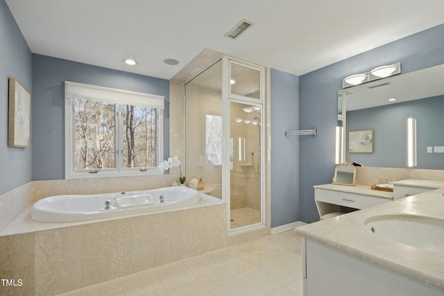 bathroom featuring vanity and plus walk in shower