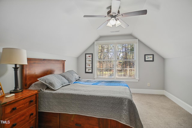 bedroom featuring baseboards, visible vents, ceiling fan, vaulted ceiling, and carpet flooring