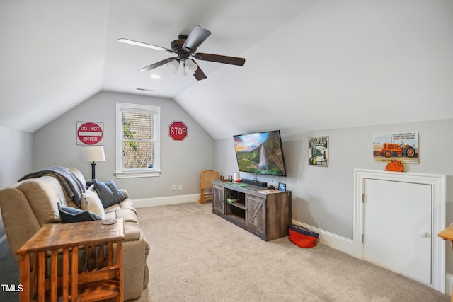 living area featuring ceiling fan, carpet flooring, visible vents, baseboards, and vaulted ceiling