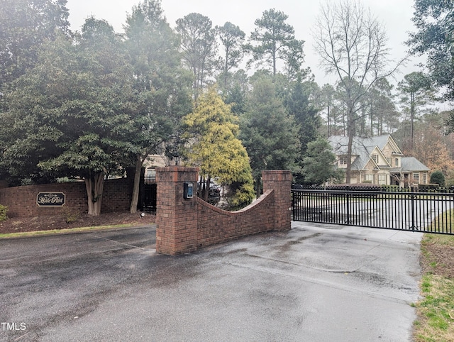 view of gate with fence